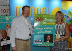 Joseph Bunting with The United Family of supermarkets and Tammy Wiard with the National Mango Board proudly show how Joseph was Retail Mango Partner of the Month March.